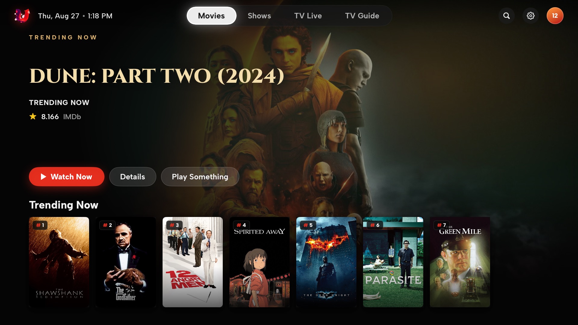 Movies home with a full-bleed hero and a ranked Trending Now row
